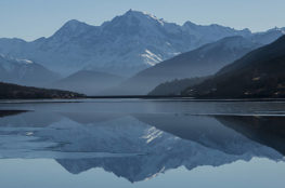 Calm body of lake between mountains